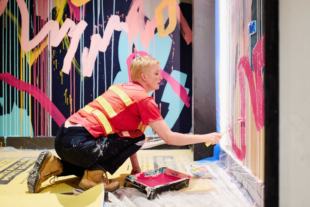 Large-scale Rowena Martinich mural in an architectural setting