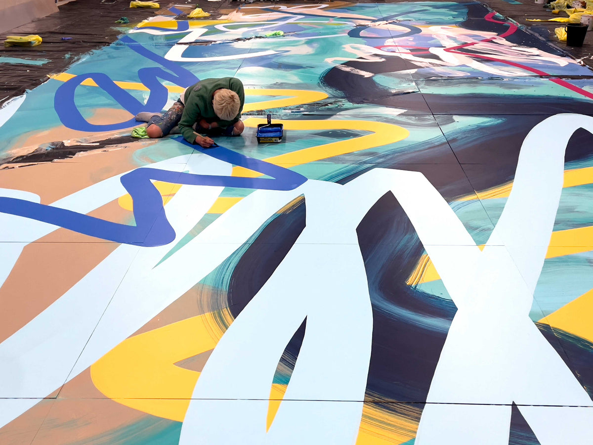 Large-scale Rowena Martinich mural in an architectural setting